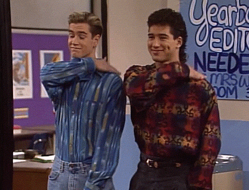 Zack Morris and Slater from Saved By The Bell pat themselves on the back 